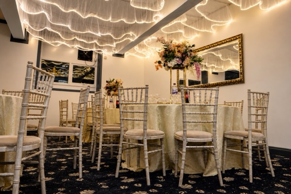 The hall at Green Lane Banqueting set for a large seated dinner